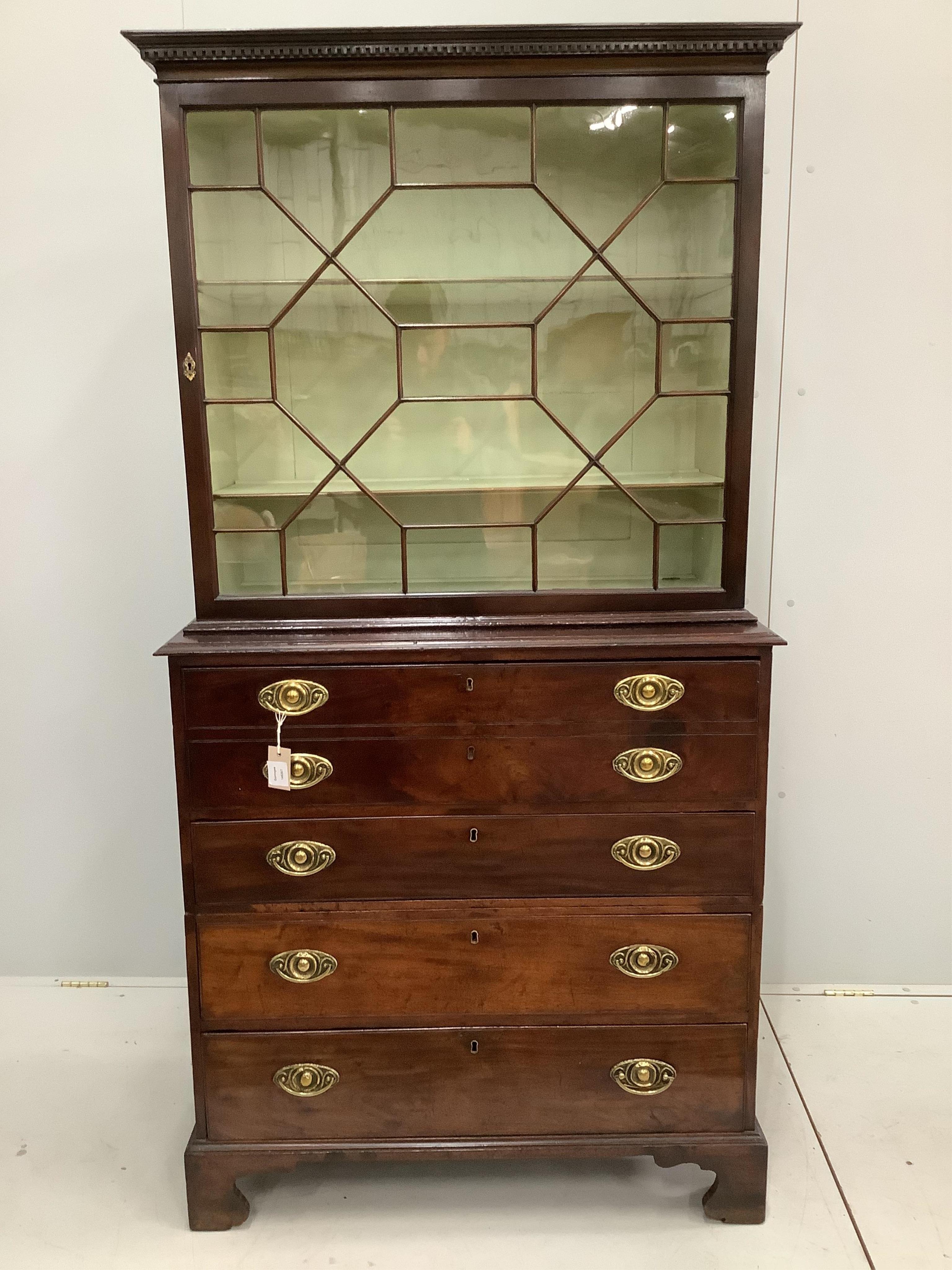 A George III mahogany secretaire chest, later bookcase top, width 94cm, depth 47cm, height 182cm. Condition - good